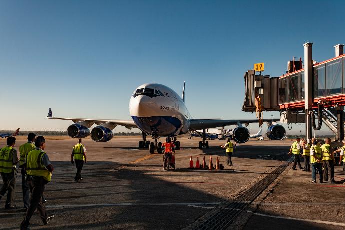 a large jetliner sitting on top of an airport tarmac